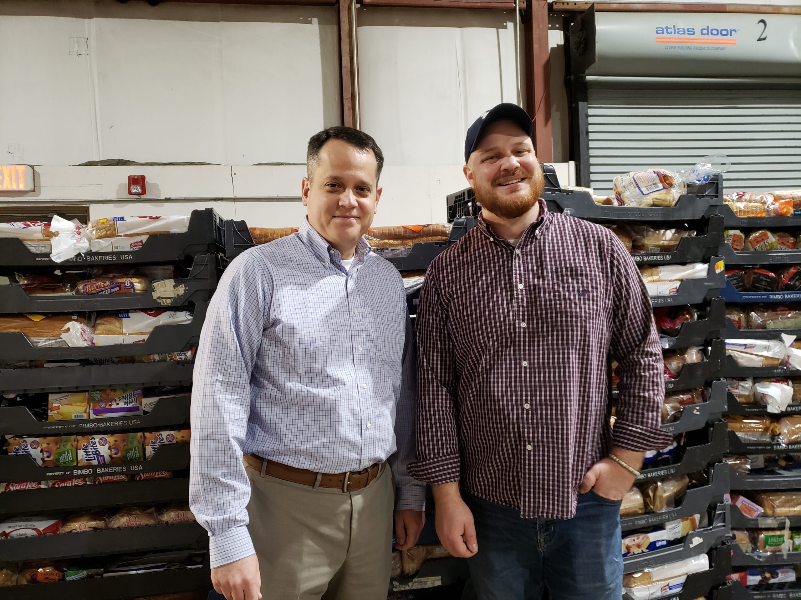 Stake President Benjamin J. Smith, left, and Second Harvest of the Big Bend’s Justin Greer.