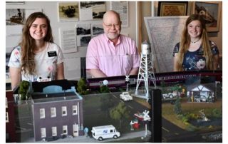 Sisters Gentry and Allen flank Grady County History Museum Director Don Nickerson.