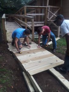 LDS Missionaries at work building a ramp