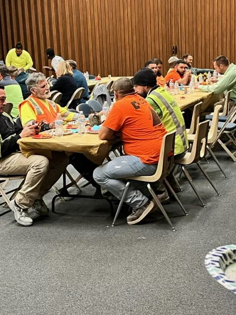 Temple construction workers enjoying dinner